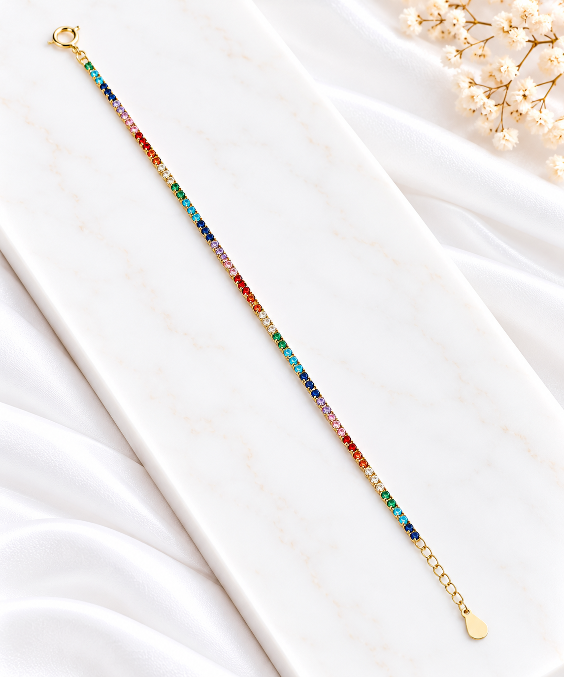 Pulseira arco-íris sobre mármore (1)